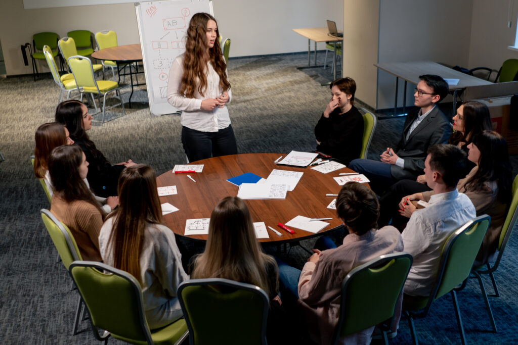 A trainer supervising a leadership skills training.